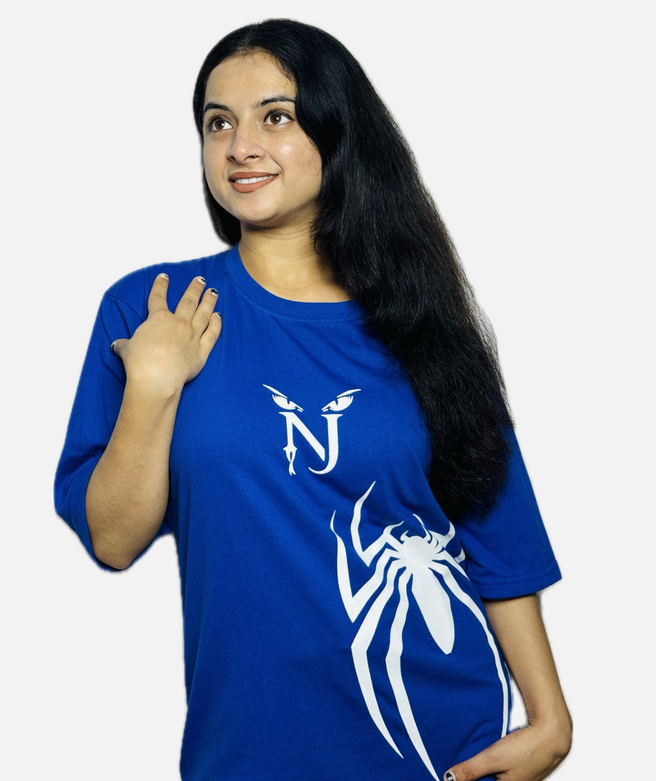Woman wearing a blue t-shirt with a white logo on a plain background