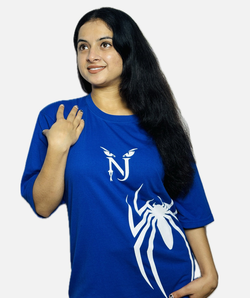 Woman wearing a blue t-shirt with a white logo on a plain background