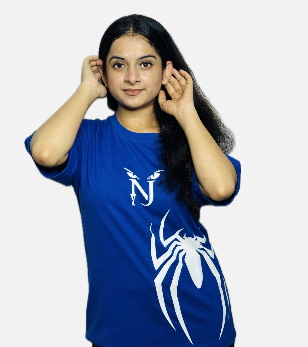 Woman wearing a blue t-shirt with a white spider design on a plain background