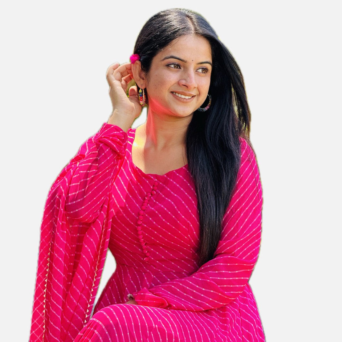 Woman wearing a bright pink traditional outfit with a white background
