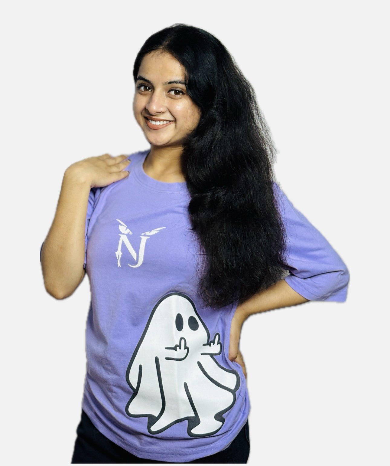Person wearing a purple t-shirt with a ghost graphic and logo on a plain background