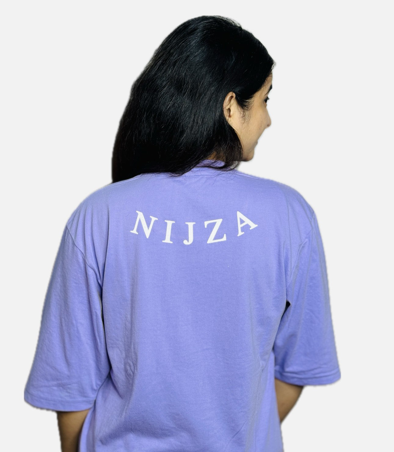 Person wearing a purple shirt with 'NIJZA' printed on the back against a white background